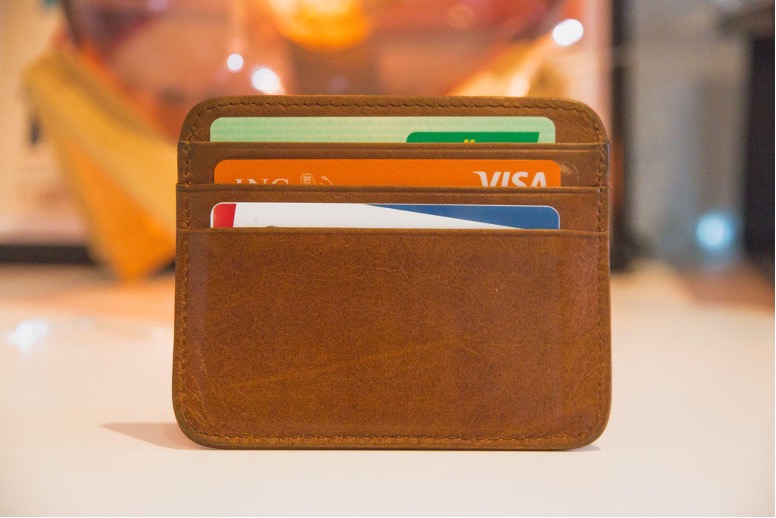 A brown wallet with credit cards