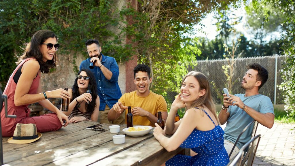 Friends drinking beer and laughing