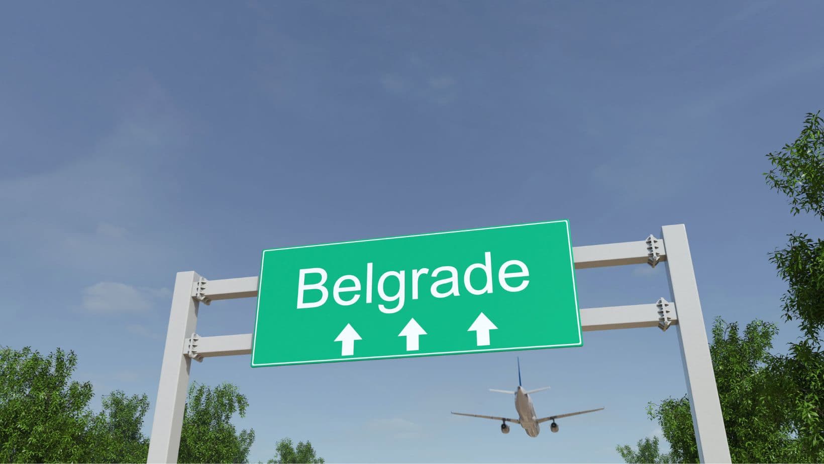 An airplane flying over the sign pointing to Belgrade