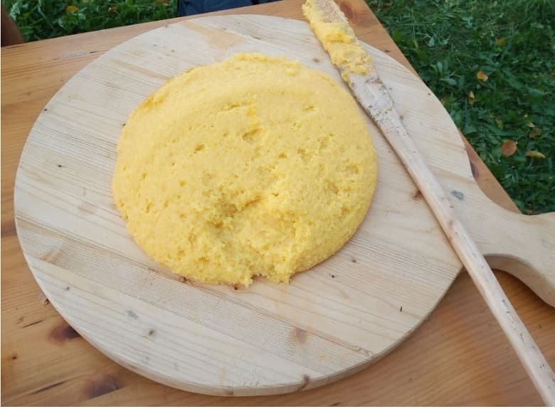 : A yellow, creamy food made of corn flour.