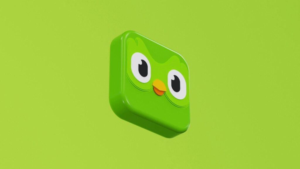 A green owl icon of the Duolingo language learning app on a green backdrop