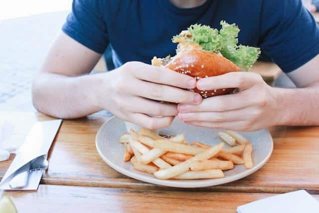 Person eating a burger