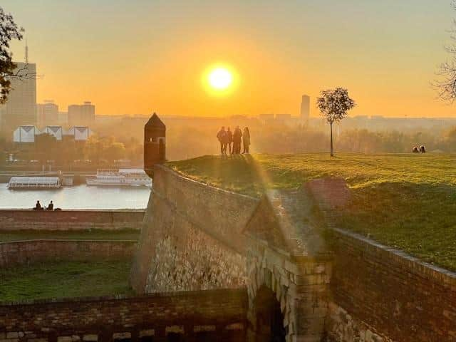 A group of people standing on top of the Kalemegdan fortress in Belgrade, Serbia.