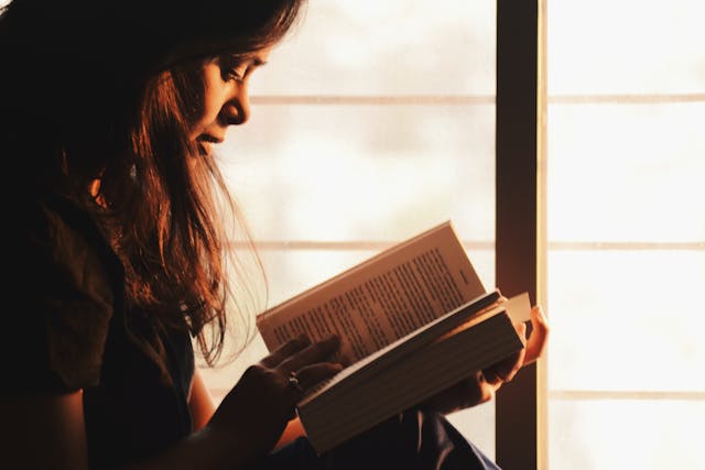 A girl reading a book in Serbian