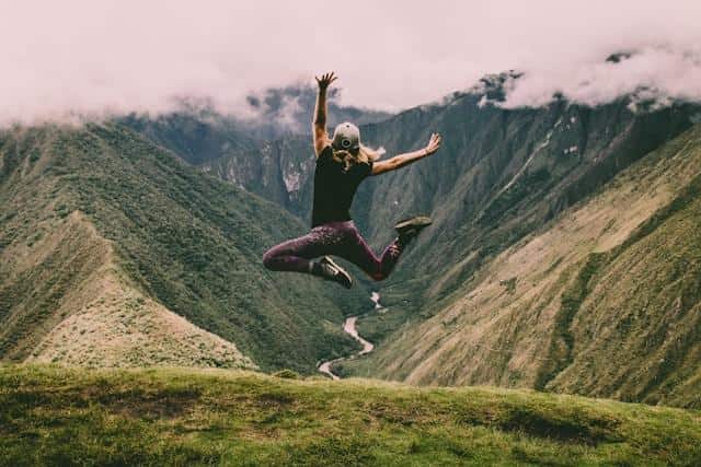 A woman jumping up in the air.