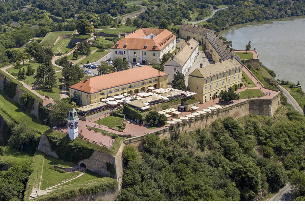 An aerial view of the Petrovaradin Fortress overlooking the river