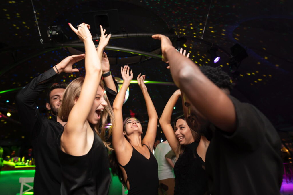 Young people dancing at a night club